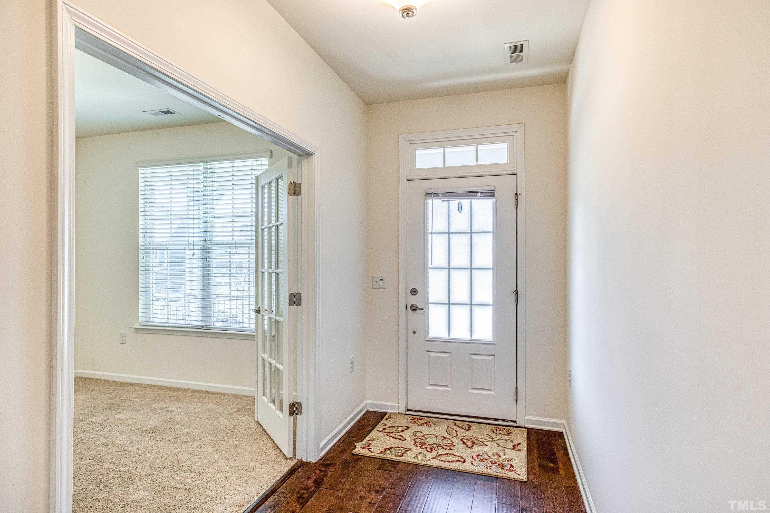 3617 Lily Orchard Way Cary, NC 27518 - Photo 8 of 47 a view of an empty room with a window