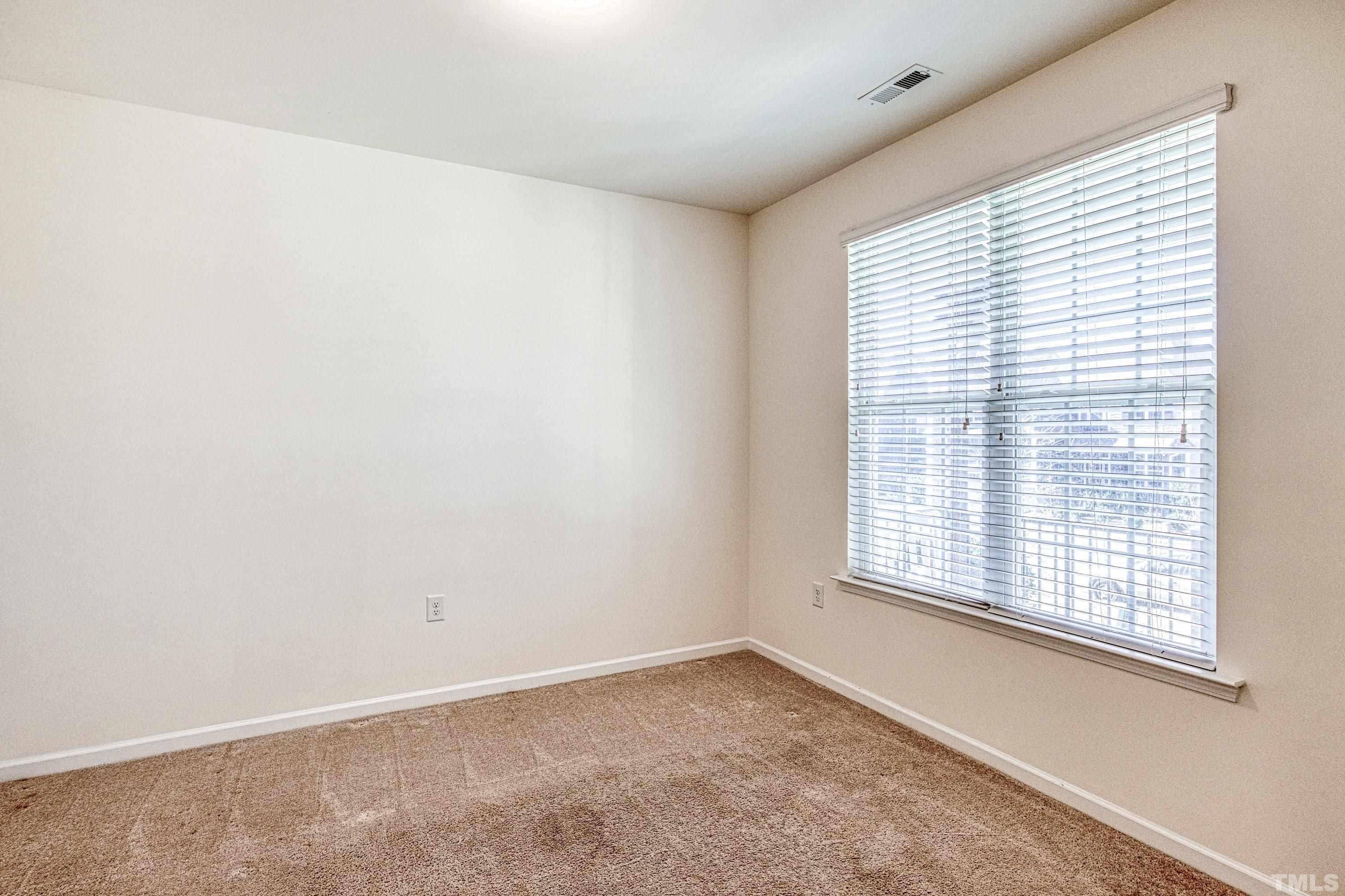 3617 Lily Orchard Way Cary, NC 27518 - Photo 10 of 47 an empty room with a window