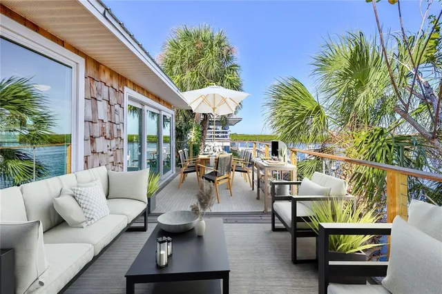 a view of a kitchen with a sink and a refrigerator