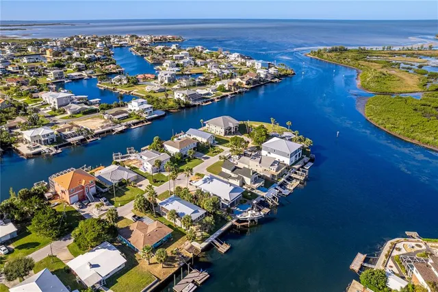 an aerial view of a house with a lake view