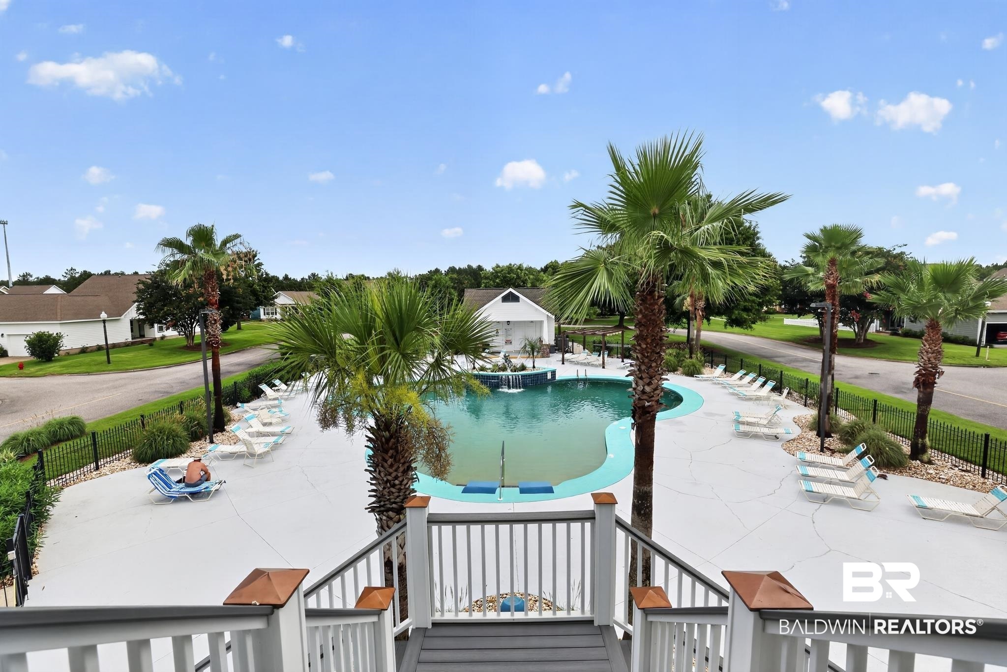 1210 Primrose Lane Foley, AL 36535 - Photo 26 of 33 Resort-style swimming pool featuring a curved design and integrated waterfall