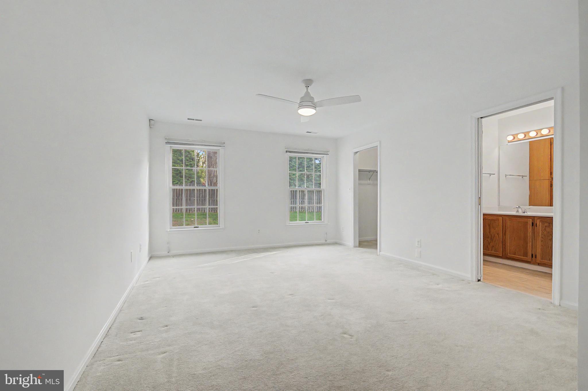 795 Eastern Point Road Annapolis, MD 21401 - Photo 9 of 38 an empty room with windows and closet