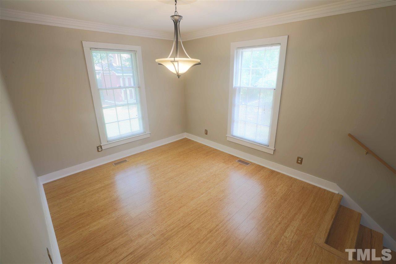 2017 Mallard Lane Raleigh, NC 27609 - Photo 13 of 25 a view of empty room with wooden floor and fan