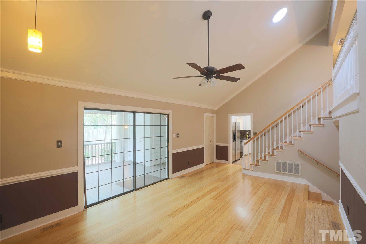 2017 Mallard Lane Raleigh, NC 27609 - Photo 5 of 25 a view of empty room with stairs and wooden floor