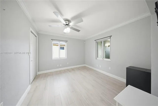 a view of an empty room with a fireplace