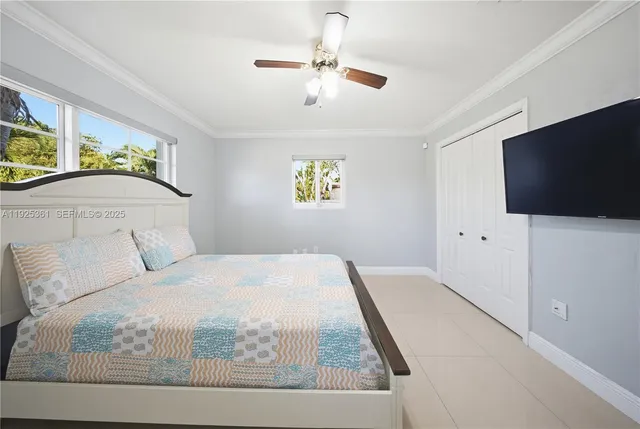 a spacious bedroom with a bed and a couch