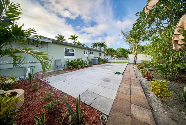 a view of a street with a building in the background