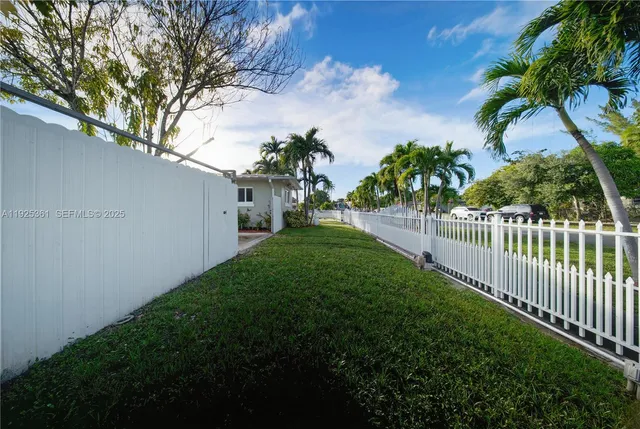a view of a pathway both side of house
