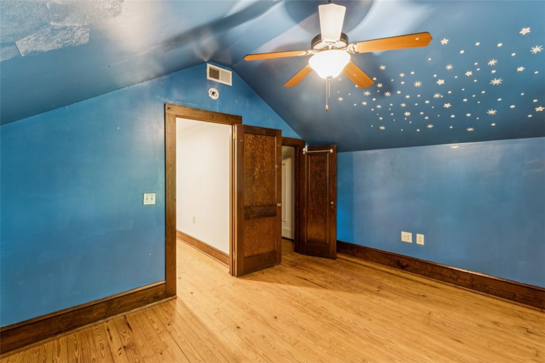 321 South Pine Street Walhalla, SC 29691 - Photo 20 of 32 A luminous space with charming hardwood flooring and a starry ceiling, ideal for restful nights.
