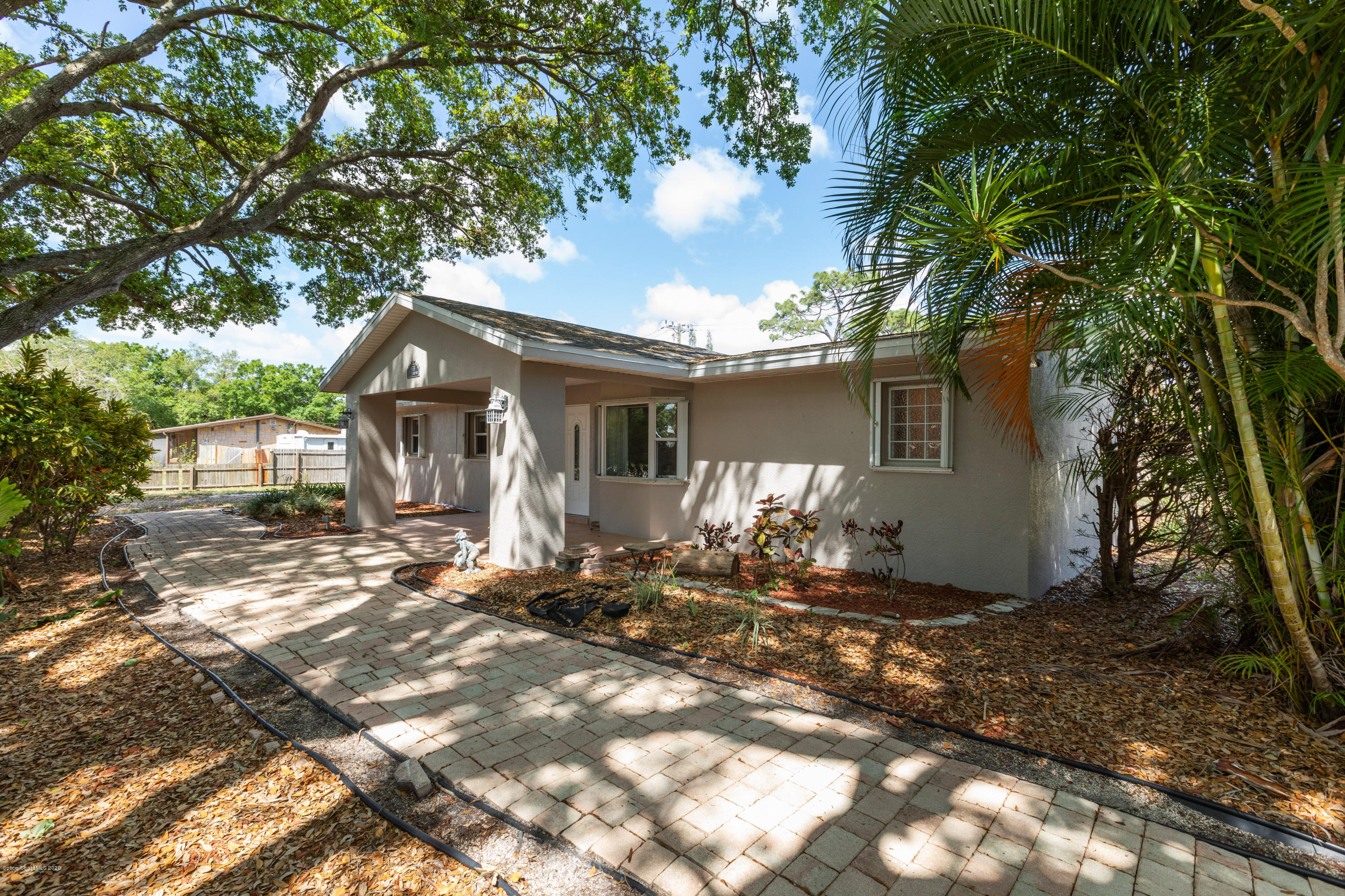 839 Knecht Road Northeast Palm Bay, FL 32905 - Photo 1 of 37 a view of a house with yard and sitting area