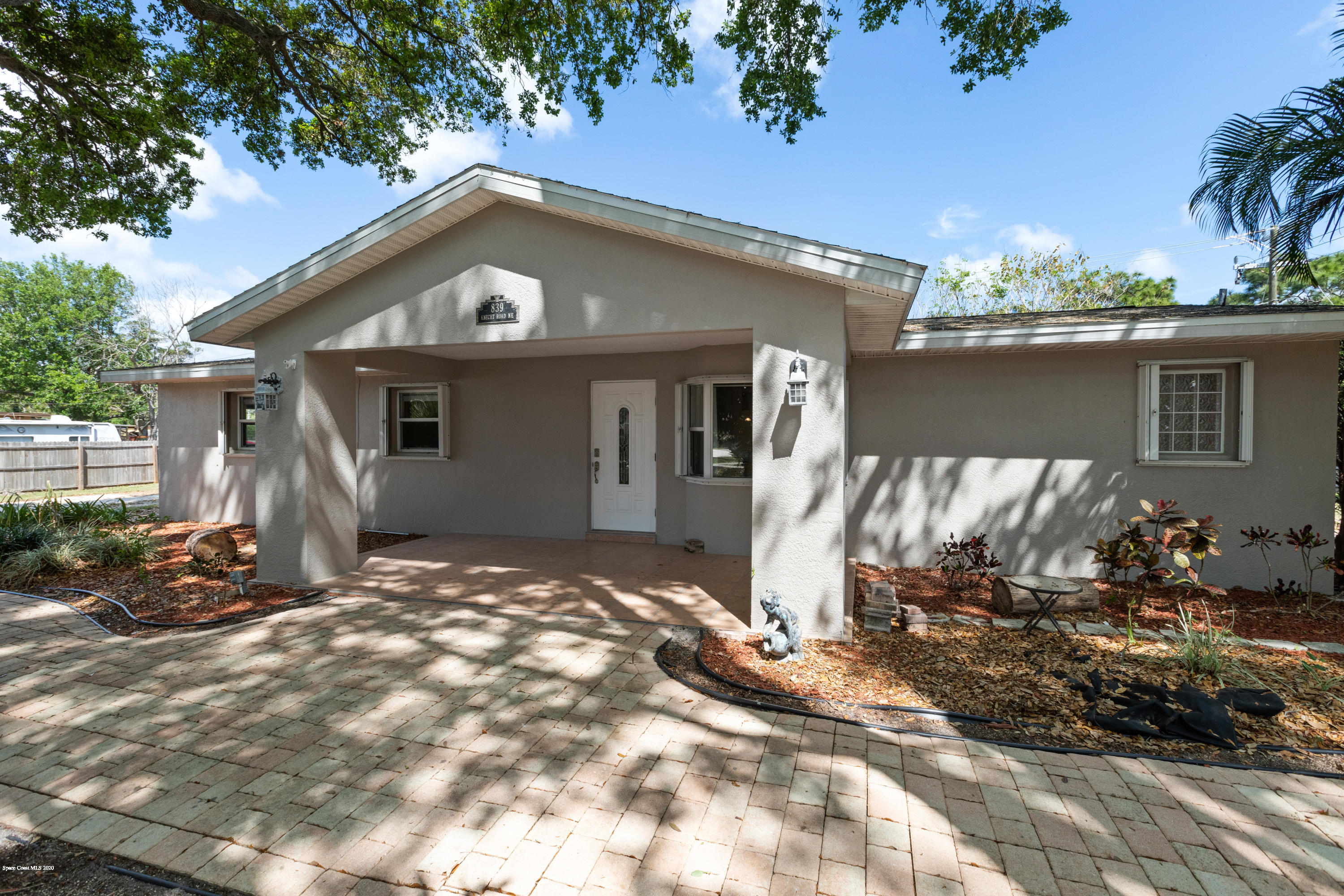 839 Knecht Road Northeast Palm Bay, FL 32905 - Photo 2 of 37 a view of a house with a patio