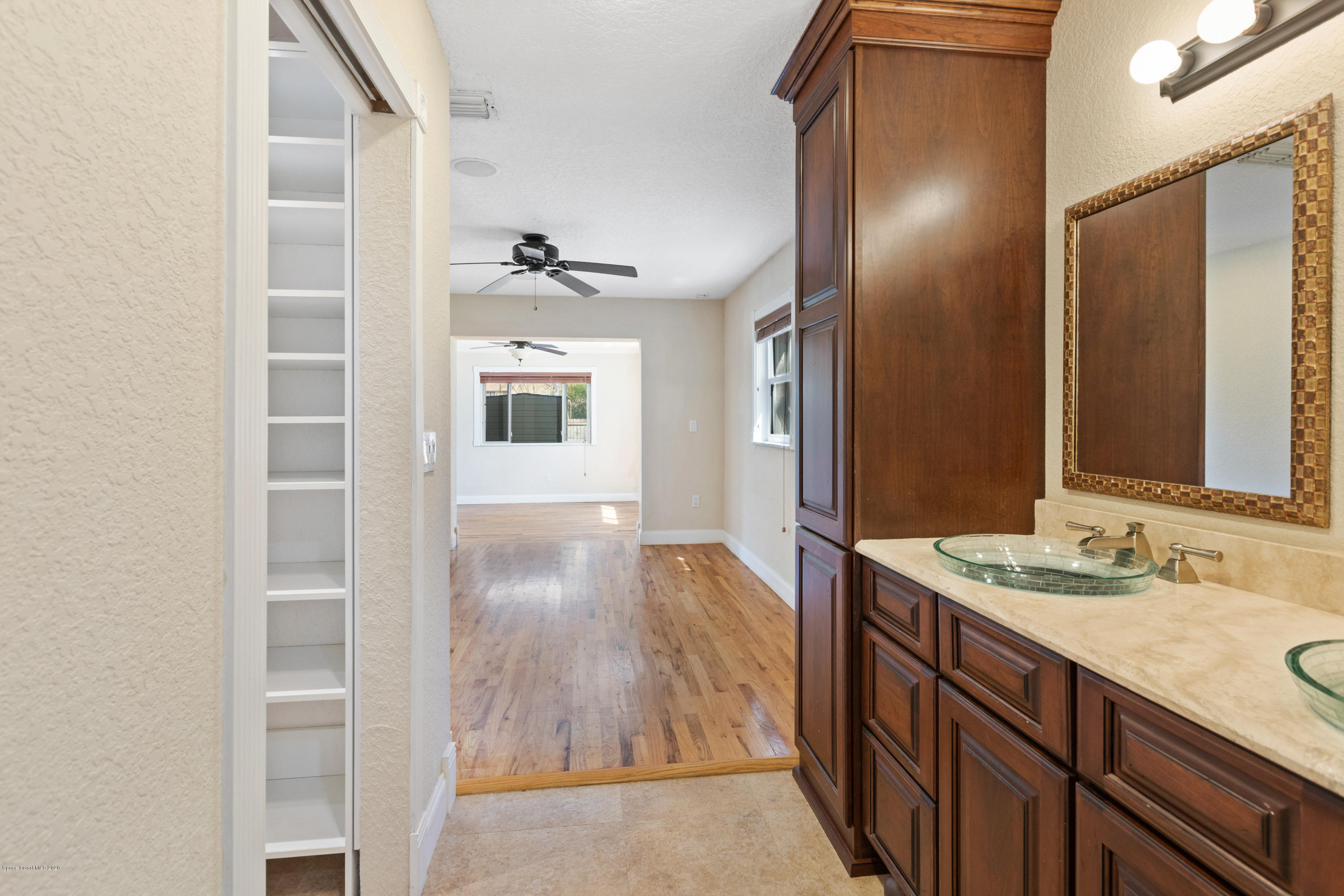 839 Knecht Road Northeast Palm Bay, FL 32905 - Photo 18 of 37 a bathroom with a sink and a mirror