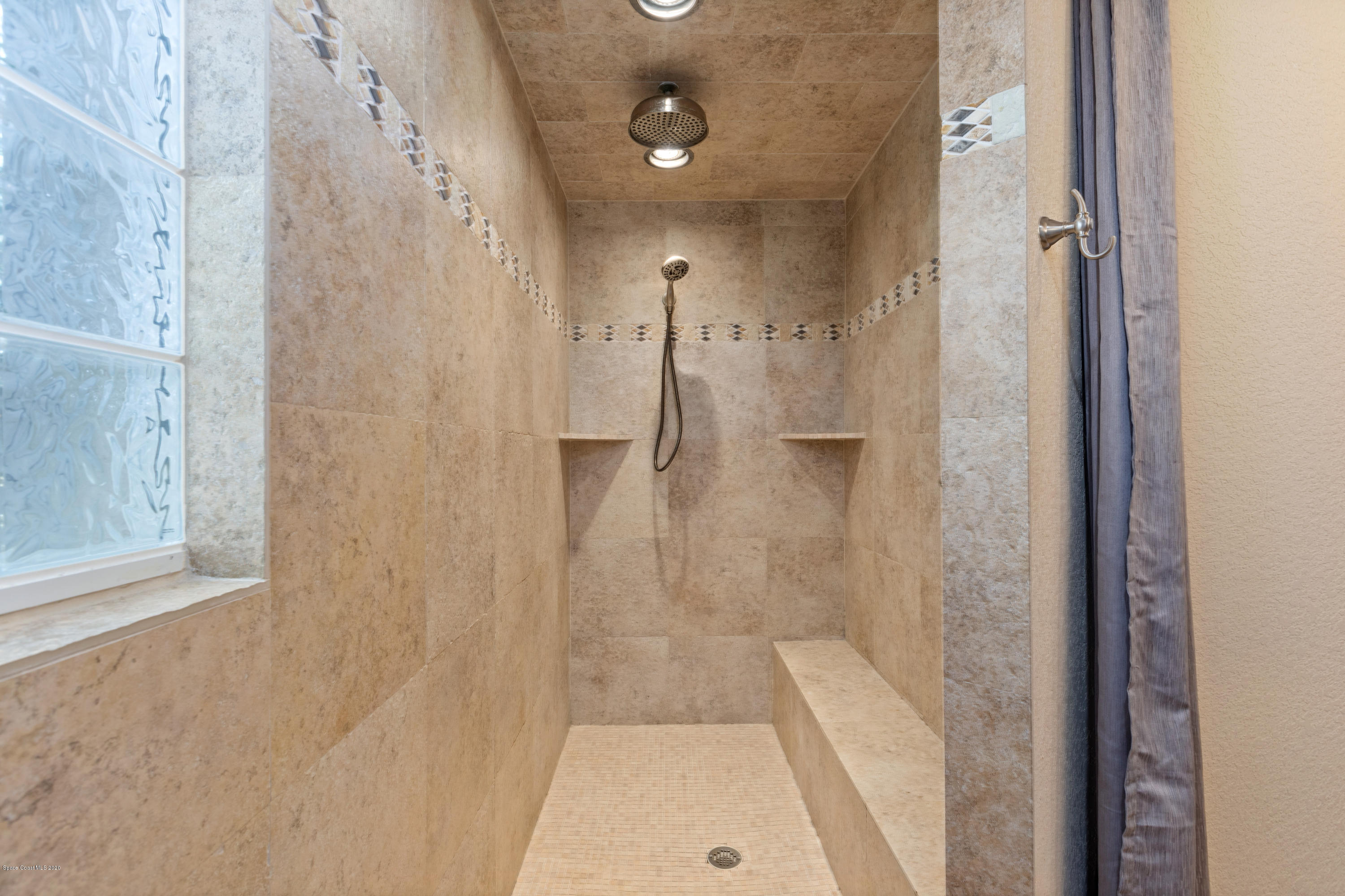 839 Knecht Road Northeast Palm Bay, FL 32905 - Photo 21 of 37 a bathroom with a shower