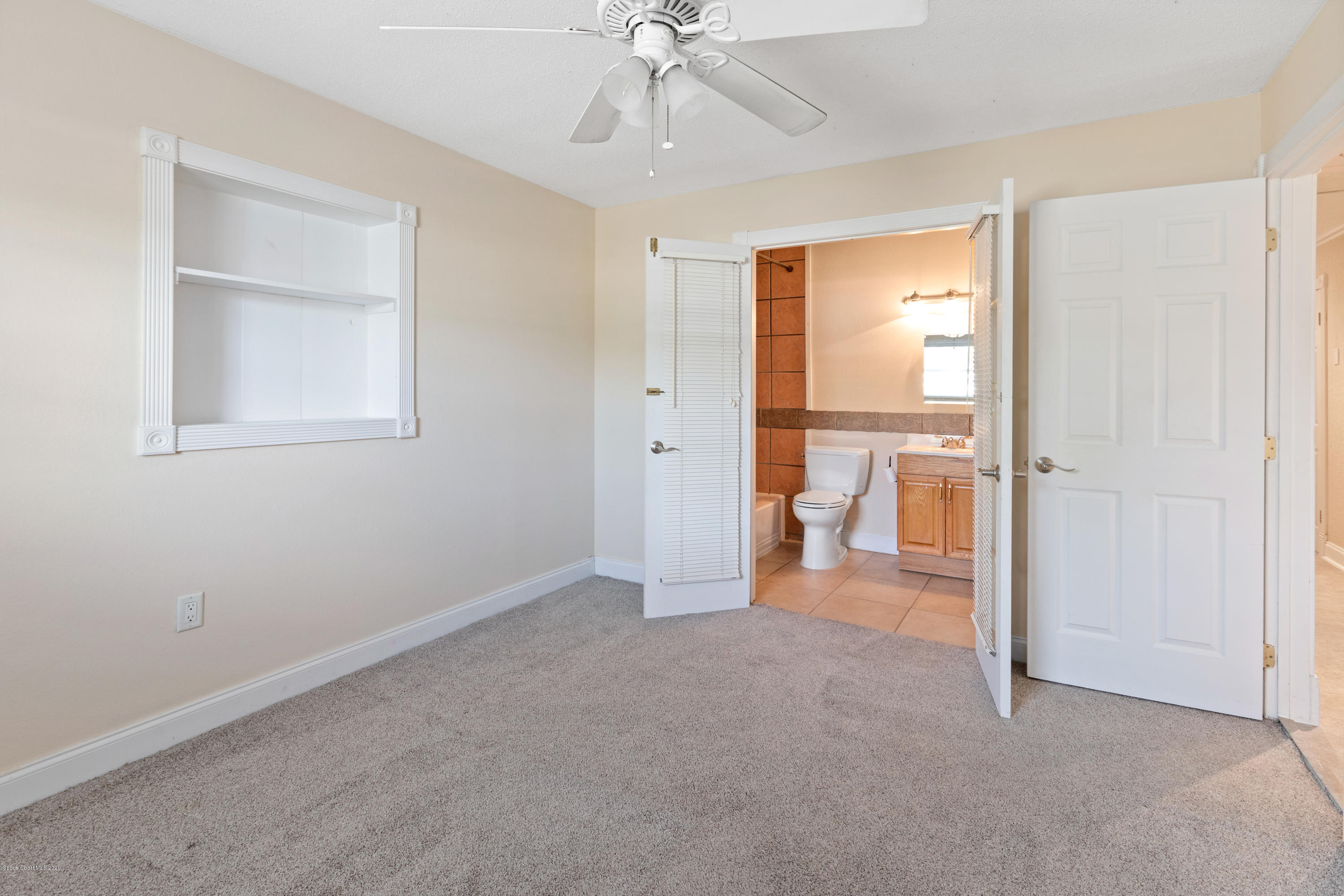 839 Knecht Road Northeast Palm Bay, FL 32905 - Photo 23 of 37 wooden floor in an empty room with a window