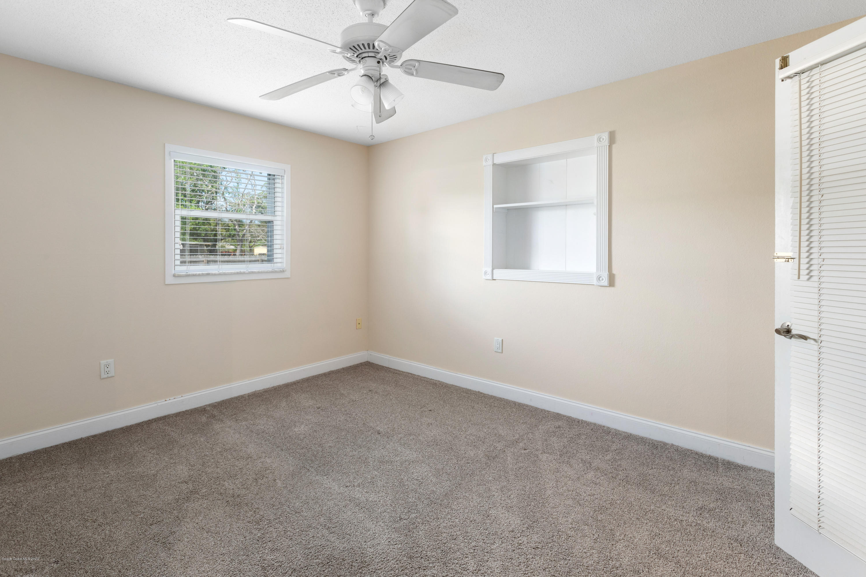 839 Knecht Road Northeast Palm Bay, FL 32905 - Photo 24 of 37 a view of an empty room with a window
