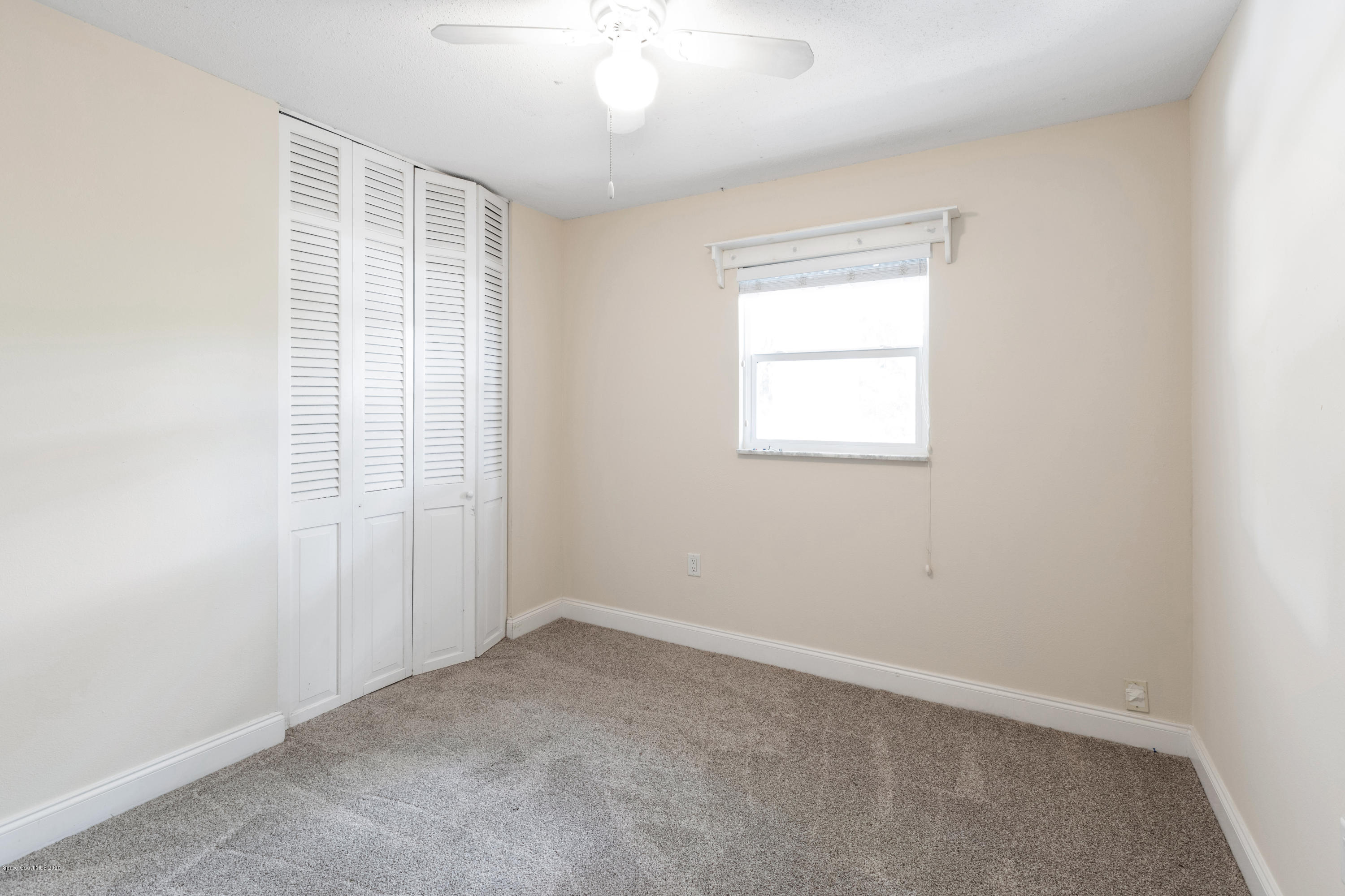 839 Knecht Road Northeast Palm Bay, FL 32905 - Photo 30 of 37 an empty room with a window