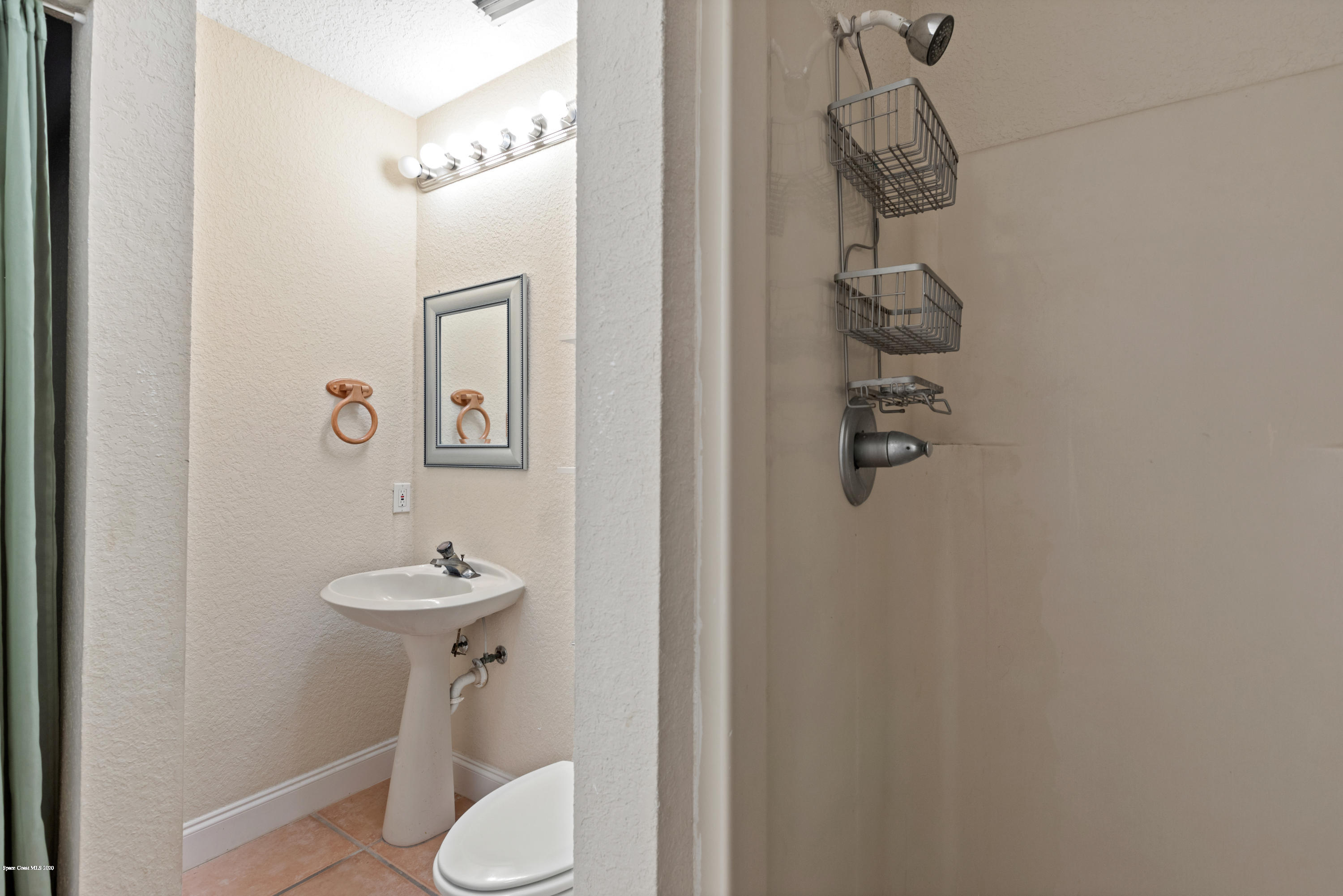 839 Knecht Road Northeast Palm Bay, FL 32905 - Photo 31 of 37 a bathroom with a shower and toilet