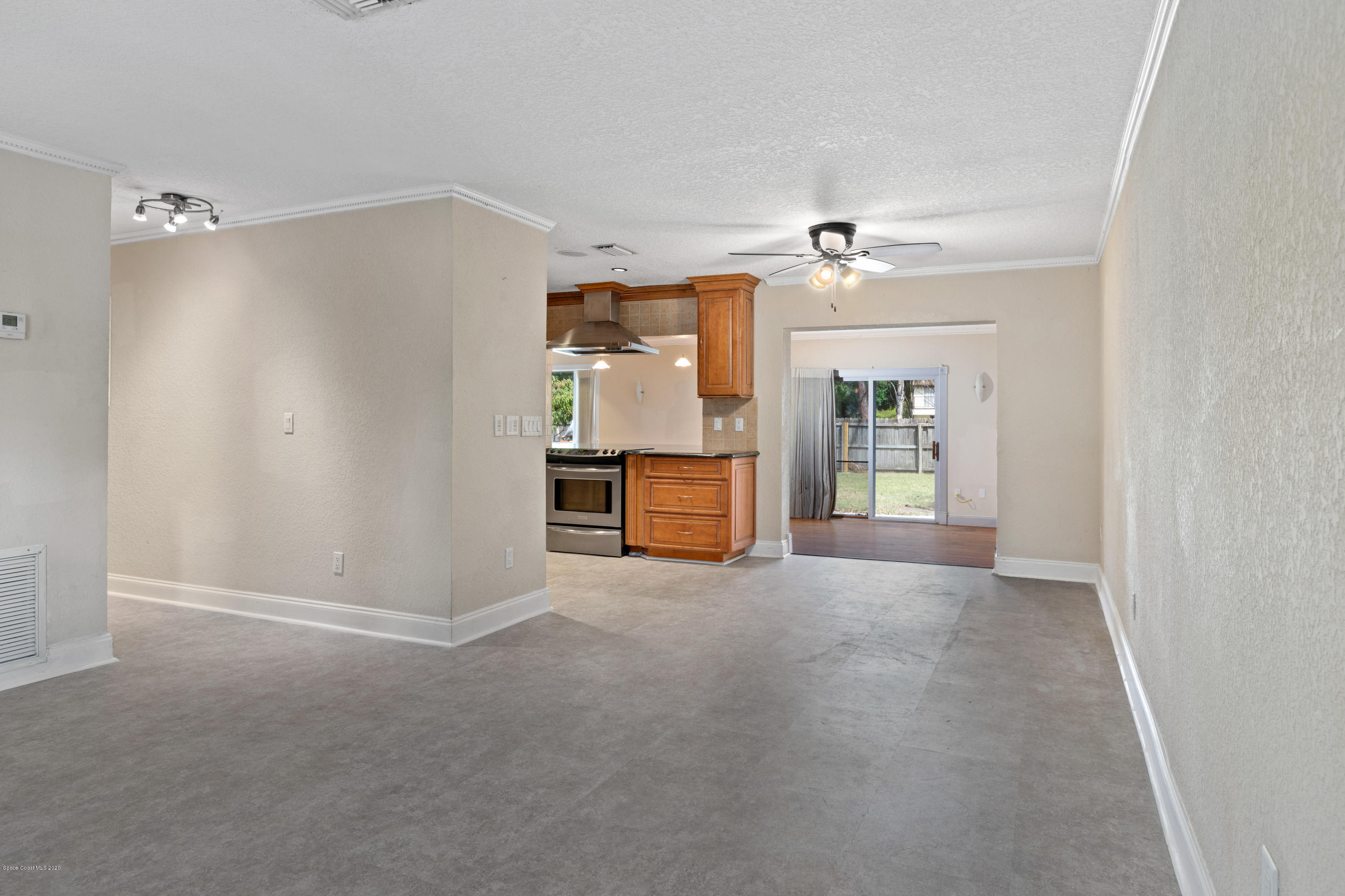 839 Knecht Road Northeast Palm Bay, FL 32905 - Photo 6 of 37 a view of an empty room with a window