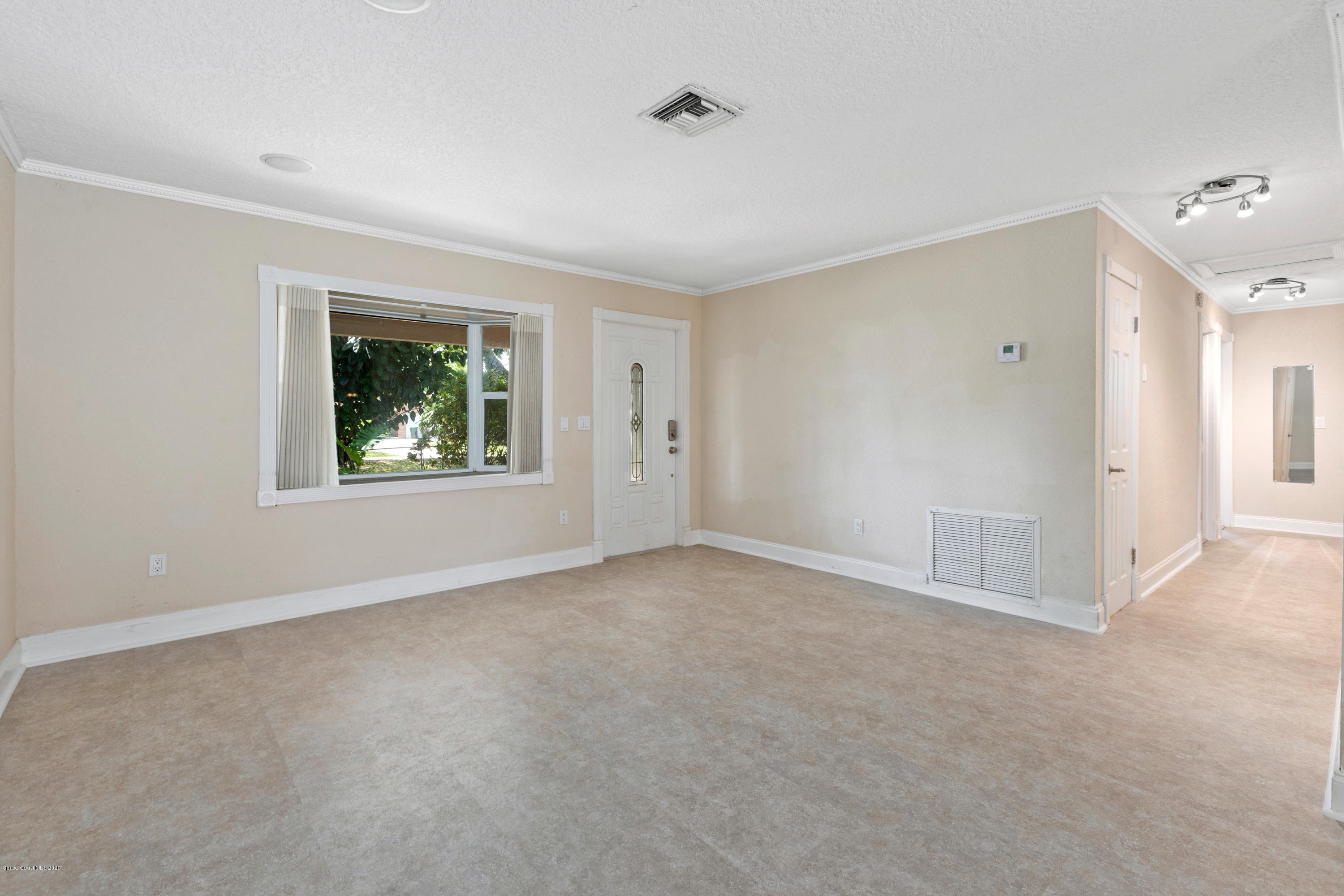 839 Knecht Road Northeast Palm Bay, FL 32905 - Photo 7 of 37 a view of an empty room with a window
