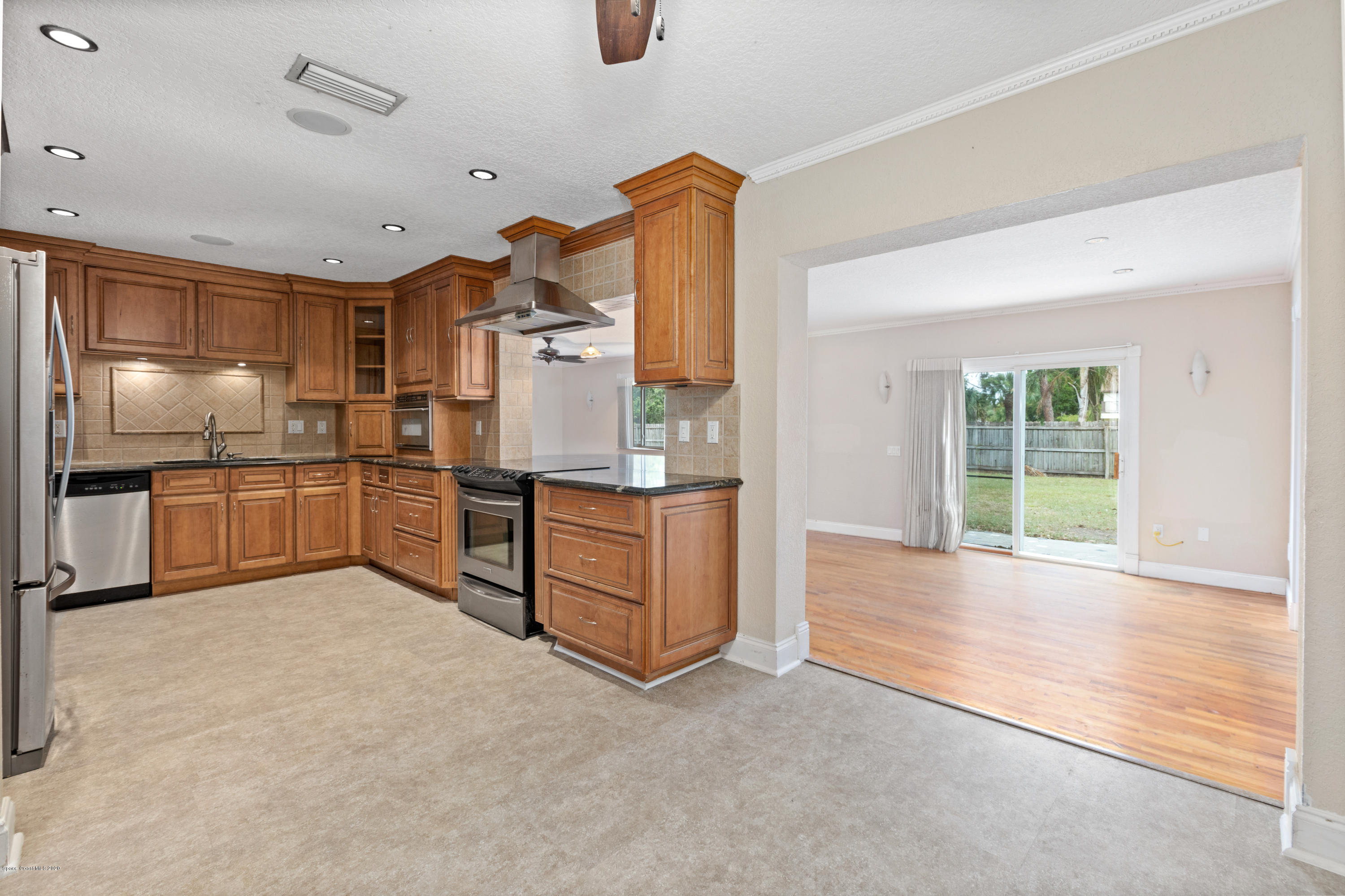 839 Knecht Road Northeast Palm Bay, FL 32905 - Photo 8 of 37 a view of kitchen with cabinets and stainless steel appliances