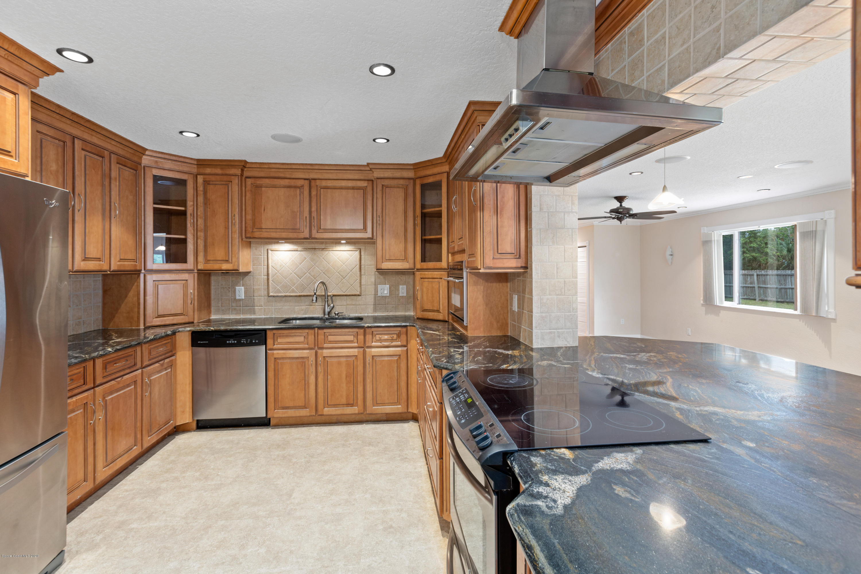 839 Knecht Road Northeast Palm Bay, FL 32905 - Photo 9 of 37 a kitchen with a sink appliances and cabinets