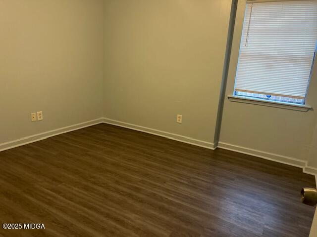 1123 Sandy Beach Drive Macon, GA 31220 - Photo 14 of 16 an empty room with wooden floor and windows