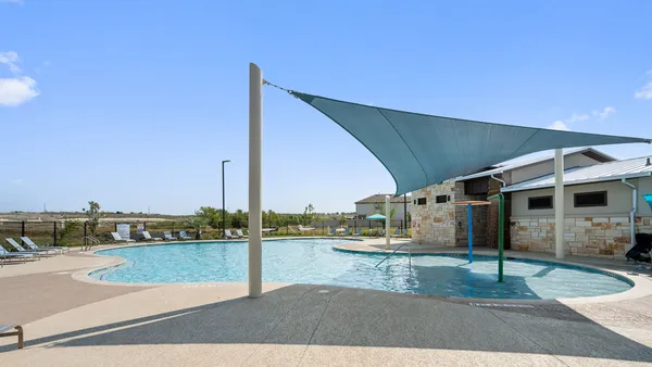 a view of a swimming pool with a balcony