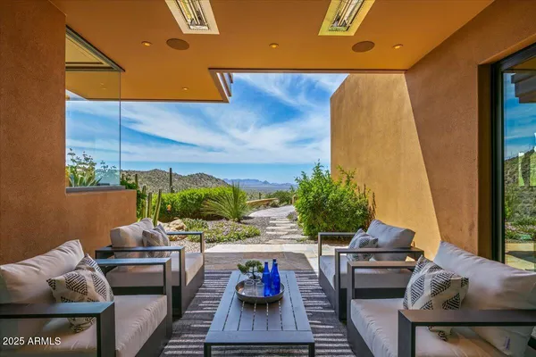 a view of a balcony with chairs