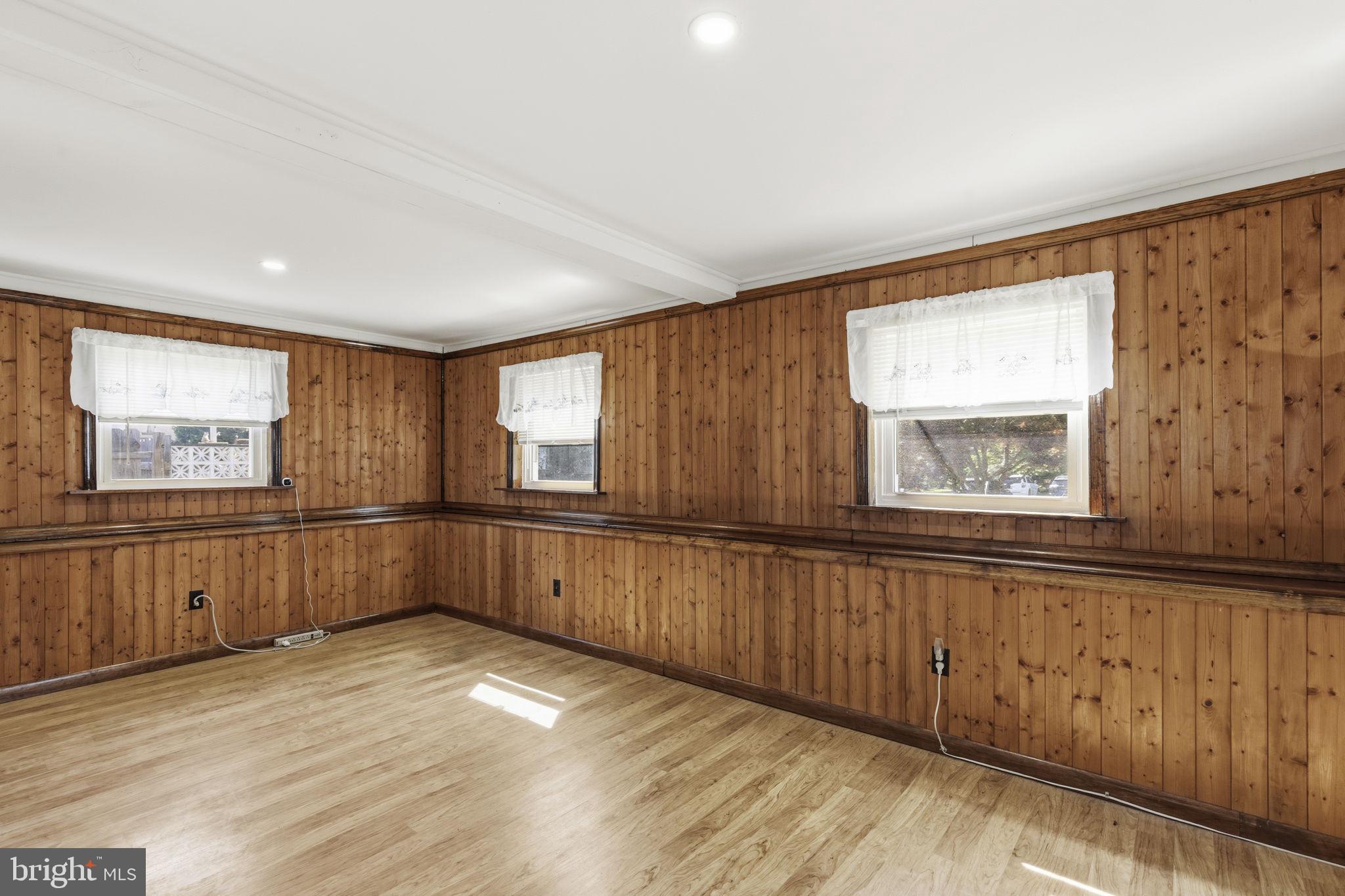 2411 Poplar Road Baltimore, MD 21221 - Photo 11 of 36 a view of a kitchen with furniture wooden floor and window