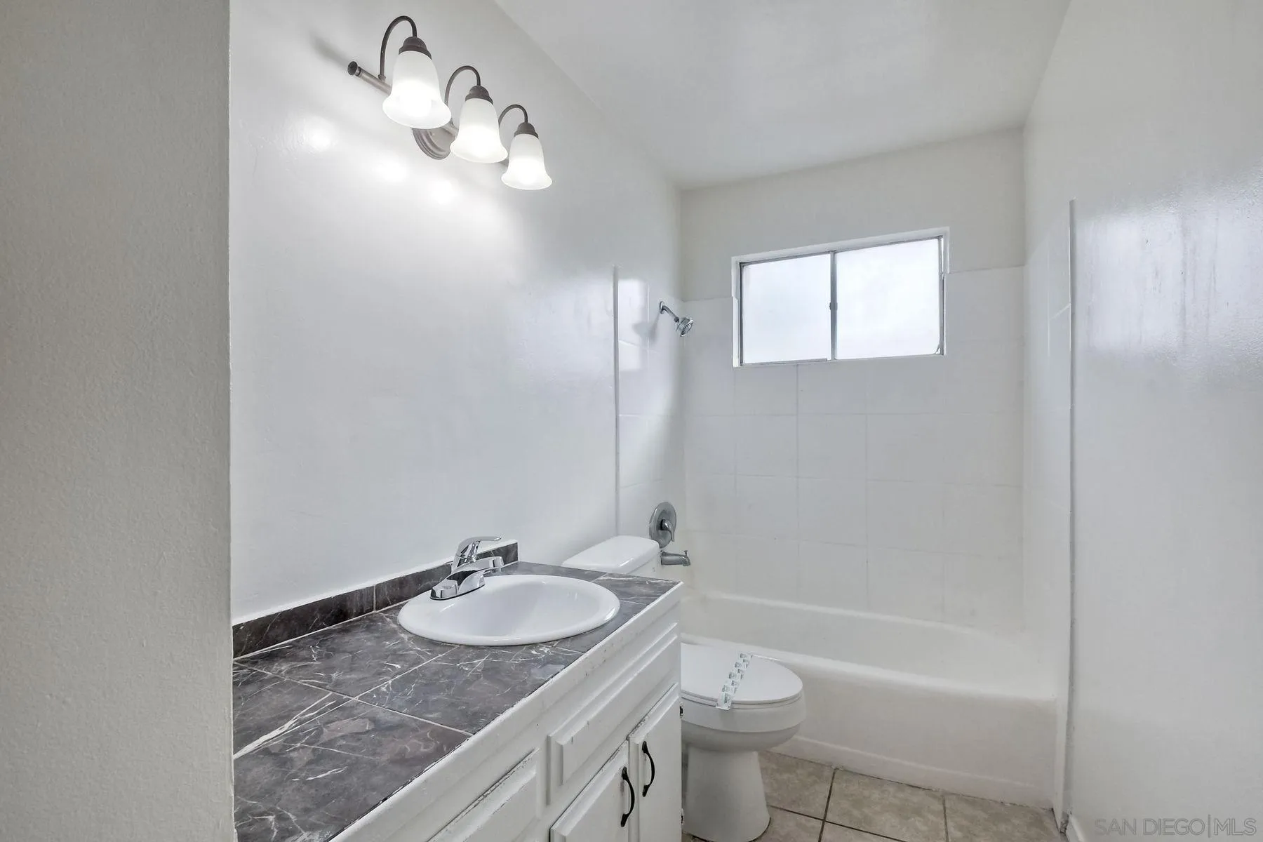 1220 Bluegrass Road Vista, CA 92083 - Photo 15 of 25 a bathroom with a granite countertop sink toilet and shower
