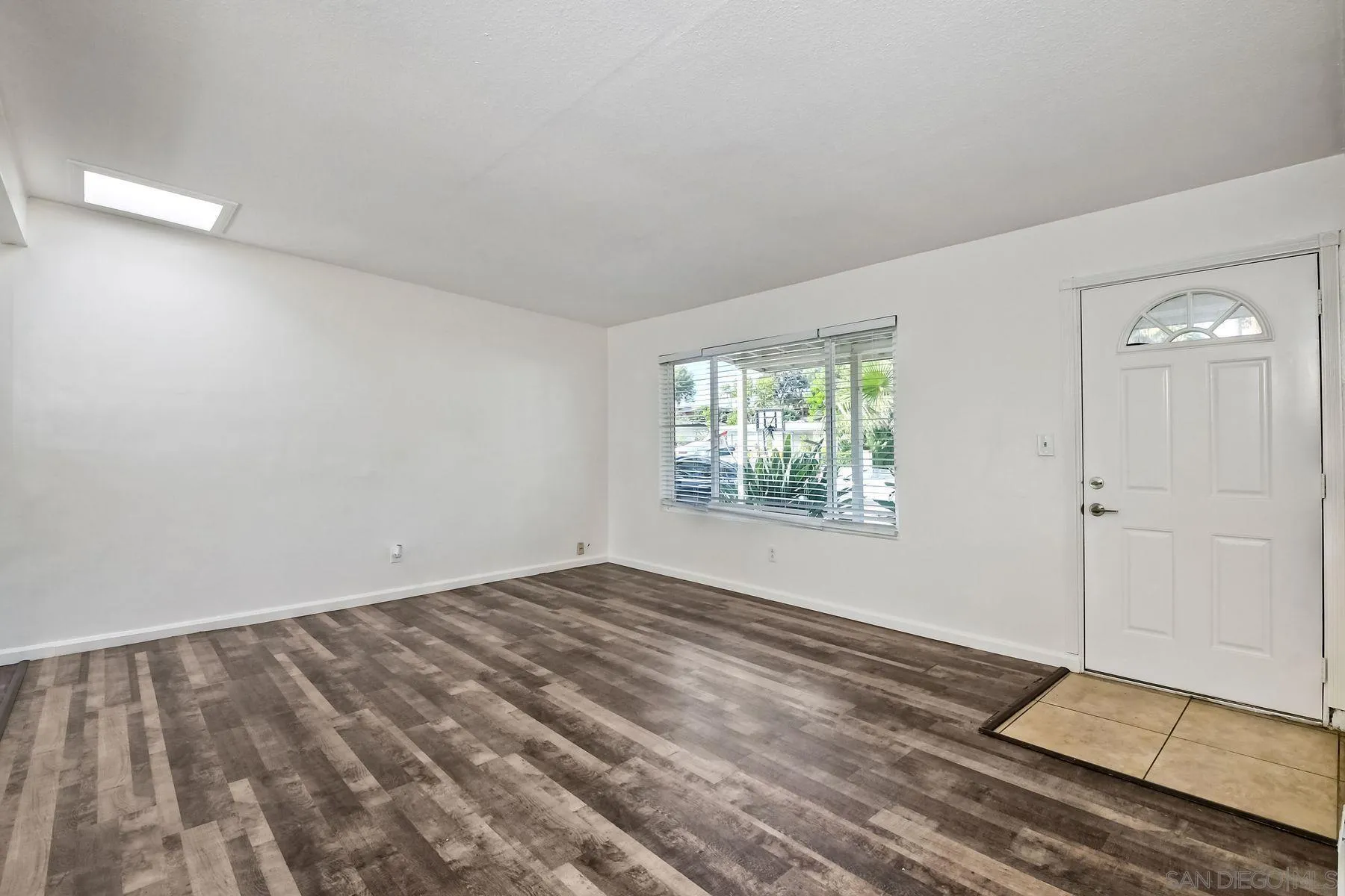 1220 Bluegrass Road Vista, CA 92083 - Photo 5 of 25 a view of an empty room and window