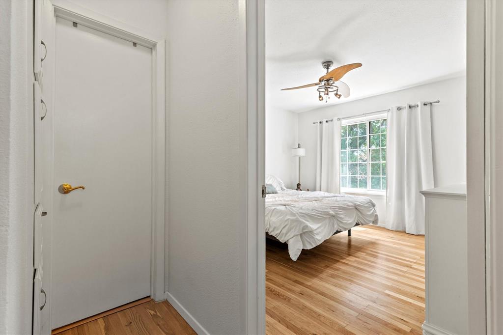 5626 Preston Oaks Road, Unit 51D Dallas, TX 75254 - Photo 14 of 19 a bed room with a bed and a window