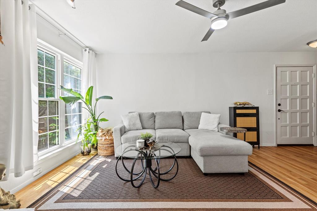 5626 Preston Oaks Road, Unit 51D Dallas, TX 75254 - Photo 4 of 19 a living room with furniture and a window