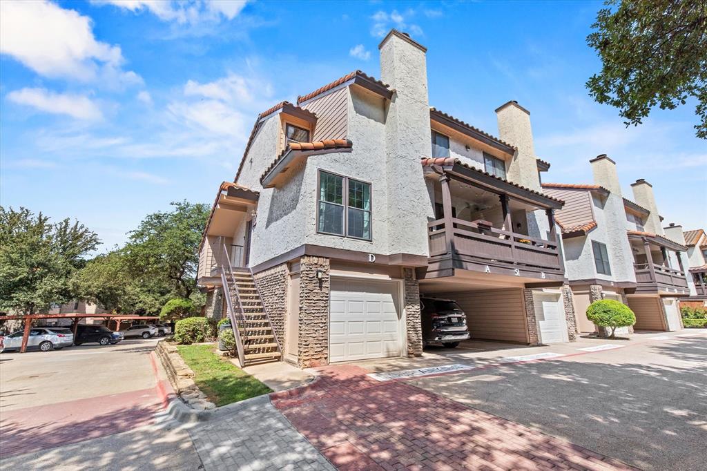 5626 Preston Oaks Road, Unit 51D Dallas, TX 75254 - Photo 6 of 19 a front view of a house with a yard