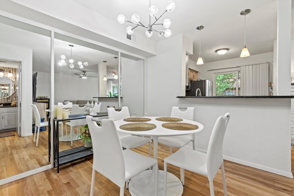 5626 Preston Oaks Road, Unit 51D Dallas, TX 75254 - Photo 10 of 19 a view of a dining room with furniture and a chandelier
