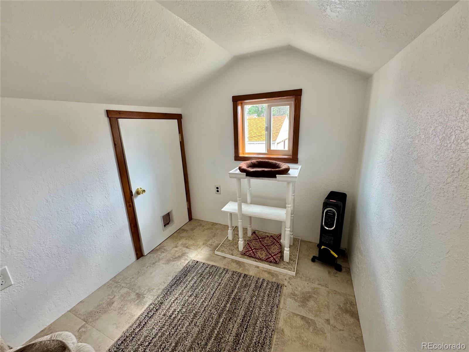 581 Bent Avenue Akron, CO 80720 - Photo 11 of 23 a view of a room that has a bed and a mirror in it