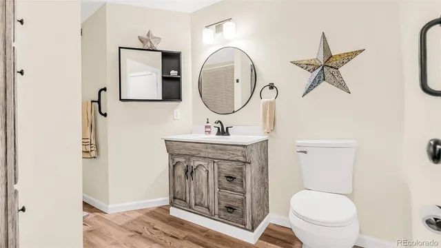 a view of a dining room with furniture wooden floor and a chandelier
