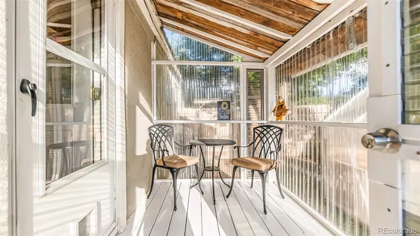 a view of a backyard with sitting area