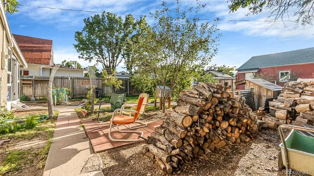 a view of a house with backyard and porch