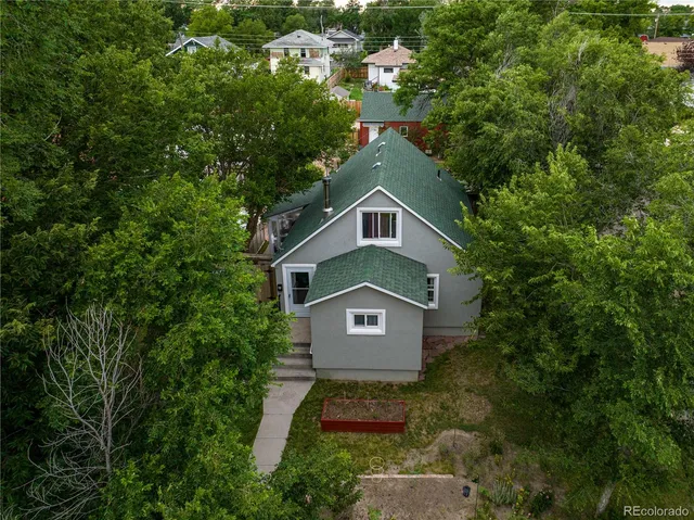 a house with trees in the background