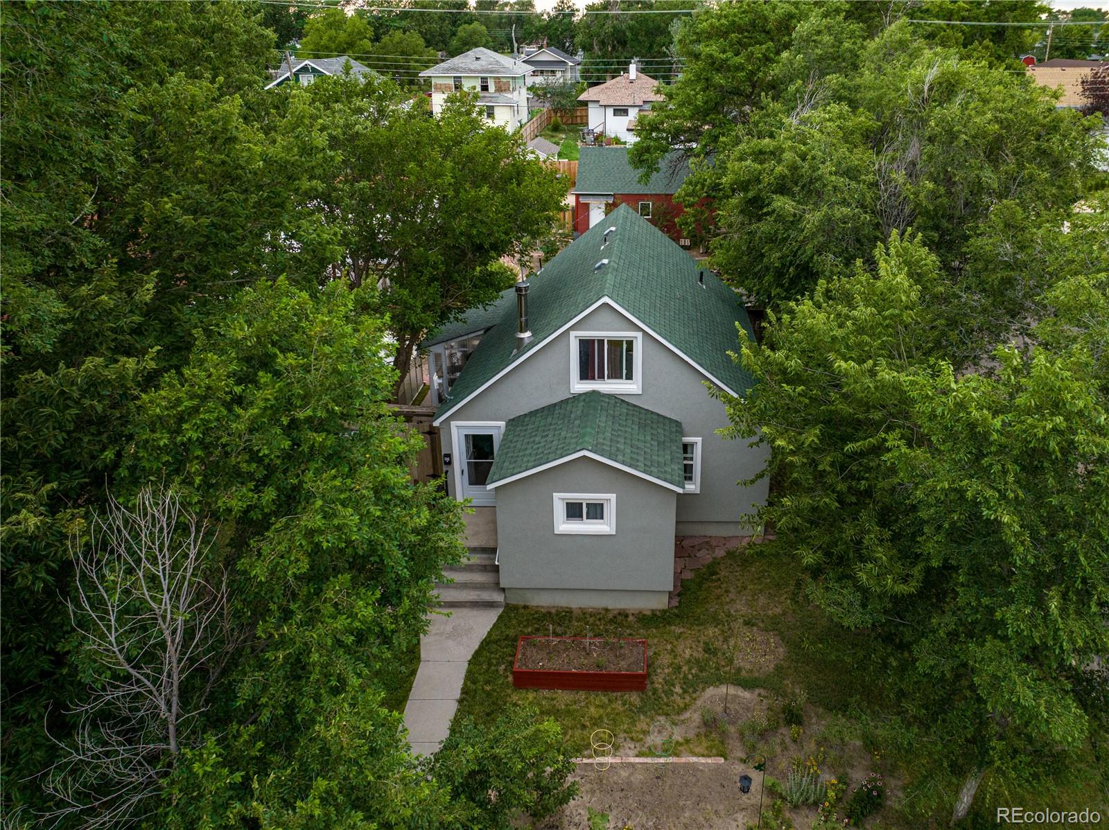 581 Bent Avenue Akron, CO 80720 - Photo 4 of 23 a house with trees in the background