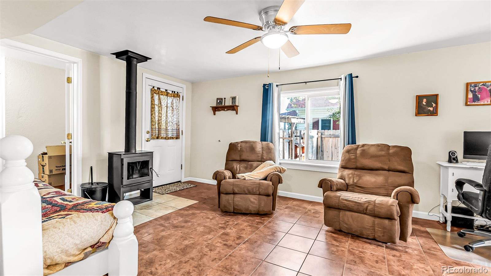 581 Bent Avenue Akron, CO 80720 - Photo 5 of 23 a living room with furniture and a flat screen tv