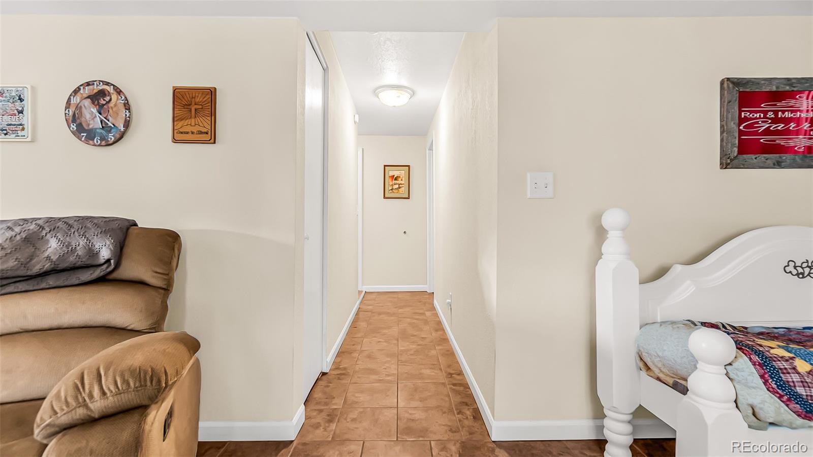 581 Bent Avenue Akron, CO 80720 - Photo 6 of 23 a living room with furniture and a wooden floor