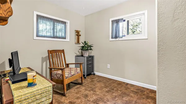 a bedroom with furniture and a window