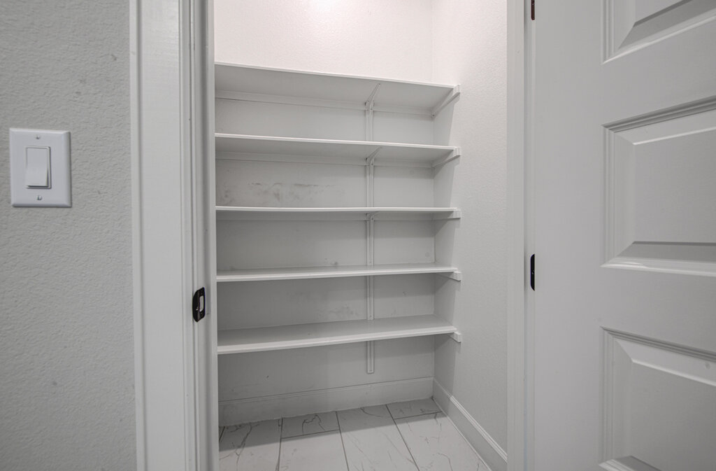 2903 Sebring Circle Austin, TX 78747 - Photo 13 of 31 a view of walk in closet with empty racks