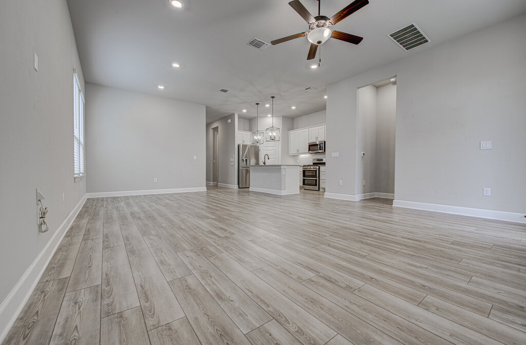 2903 Sebring Circle Austin, TX 78747 - Photo 17 of 31 a view of empty room with wooden floor and fan