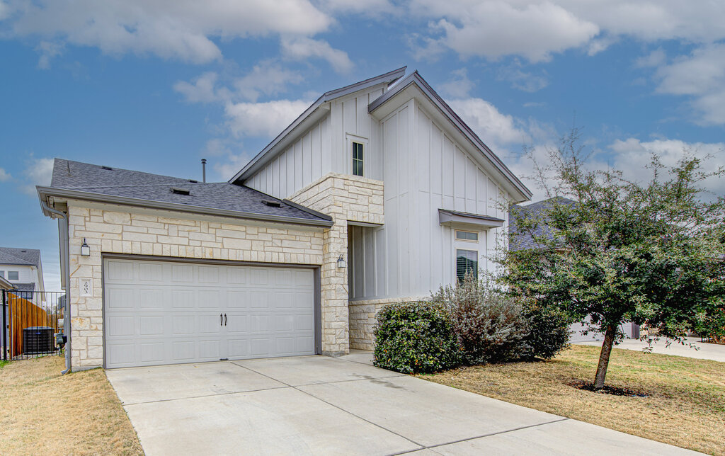 2903 Sebring Circle Austin, TX 78747 - Photo 2 of 31 a front view of a house with a garden