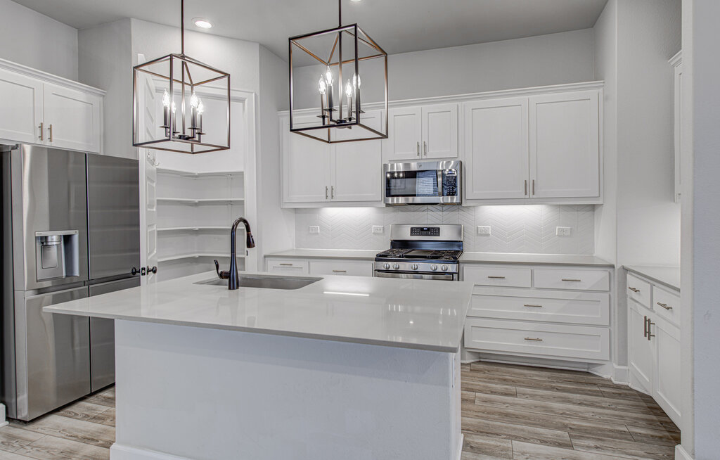 2903 Sebring Circle Austin, TX 78747 - Photo 21 of 31 a kitchen with stainless steel appliances granite countertop a sink and cabinets