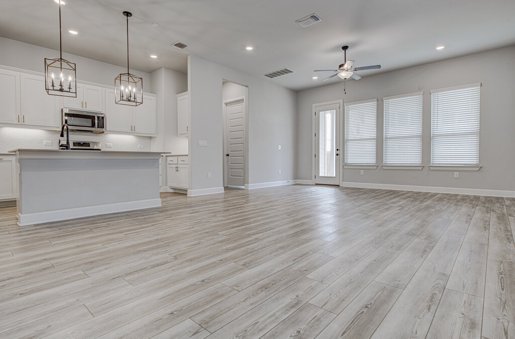 2903 Sebring Circle Austin, TX 78747 - Photo 30 of 31 a large kitchen with stainless steel appliances granite countertop a stove a refrigerator and a wooden floors