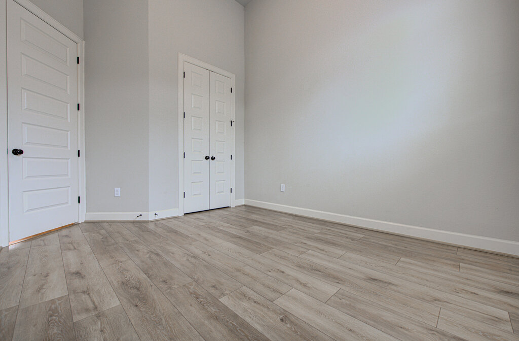 2903 Sebring Circle Austin, TX 78747 - Photo 5 of 31 a view of an empty room with wooden floor